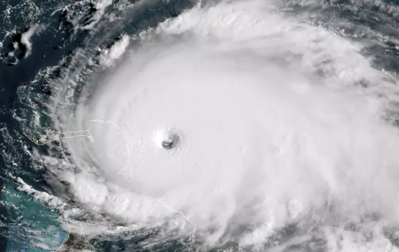 This satellite image obtained from NOAA/RAMMB, shows Tropical Storm Dorian as it approaches the Bahamas at 13:40 UTC on September 1, 2019. - Monster storm Dorian unleashed "catastrophic conditions" as it hit the northwestern Bahamas Sunday, becoming the strongest hurricane ever recorded in the region, US forecasters said. "Catastrophic hurricane conditions are occurring in the Abacos Islands and will spread across Grand Bahama Island later today and tonight," the National Hurricane Center wrote in its latest bulletin at 1500 GMT.Packing maximum sustained winds of 180 miles per hour (285 kph), the NHC said Dorian was now "the strongest hurricane in modern records for the northwestern Bahamas." (Photo by HO / NOAA/RAMMB / AFP) / RESTRICTED TO EDITORIAL USE - MANDATORY CREDIT "AFP PHOTO / NOAA/RAMMB/HANDOUT" - NO MARKETING - NO ADVERTISING CAMPAIGNS - DISTRIBUTED AS A SERVICE TO CLIENTS