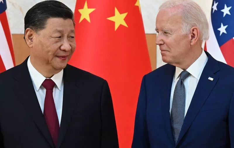 (FILES) US President Joe Biden (R) and China's President Xi Jinping (L) meet on the sidelines of the G20 Summit in Nusa Dua on the Indonesian resort island of Bali on November 14, 2022. China's top diplomat will pay a rare visit to Washington this week, the United States announced October 23, 2023, paving the way for a potential visit by President Xi Jinping aimed at keeping tensions in check. Foreign Minister Wang Yi, the highest-ranking Chinese official in the US capital in nearly five years, will visit from October 26 through October 28 against a backdrop of friction over trade, Ukraine, the Middle East, Taiwan and China's assertive actions at sea near the Philippines. (Photo by SAUL LOEB / AFP)