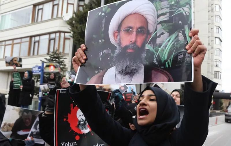Iranian and Turkish demonstrators hold pictures of Shiite cleric Sheikh Nimr al-Nimr as they protest outside the Saudi Embassy in Ankara, on January 3, 2016, to protest against the execution by Saudi Arabia of a prominent Shiite cleric which they saw as a deliberate sectarian aggression.
Nimr and other Shiite activists were among a total of 47 people executed, most of them described by the interior ministry as involved in killings by Al-Qaeda.
 / AFP / ADEM ALTAN