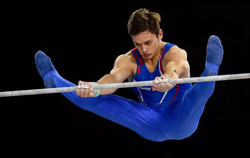 MONTREAL, QC - OCTOBER 08: Tin Srbic of Croatia competes on the horizontal bar during the individual apparatus finals of the Artistic Gymnastics World Championships on October 8, 2017 at Olympic Stadium in Montreal, Canada.   Minas Panagiotakis/Getty Images/AFP