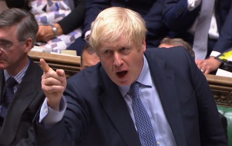 A video grab from footage broadcast by the UK Parliament's Parliamentary Recording Unit (PRU) shows Britain's Prime Minister Boris Johnson speaking during his first Prime Ministers Questions session in the House of Commons in London on September 4, 2019. - Prime Minister Boris Johnson headed into a fresh Brexit showdown in parliament on Wednesday after being dealt a stinging defeat over his promise to get Britain out of the EU at any cost next month. (Photo by - / PRU / AFP) / RESTRICTED TO EDITORIAL USE - MANDATORY CREDIT " AFP PHOTO / PRU " - NO USE FOR ENTERTAINMENT, SATIRICAL, MARKETING OR ADVERTISING CAMPAIGNS - EDITORS NOTE THE IMAGE HAS BEEN DIGITALLY ALTERED AT SOURCE TO OBSCURE VISIBLE DOCUMENTS