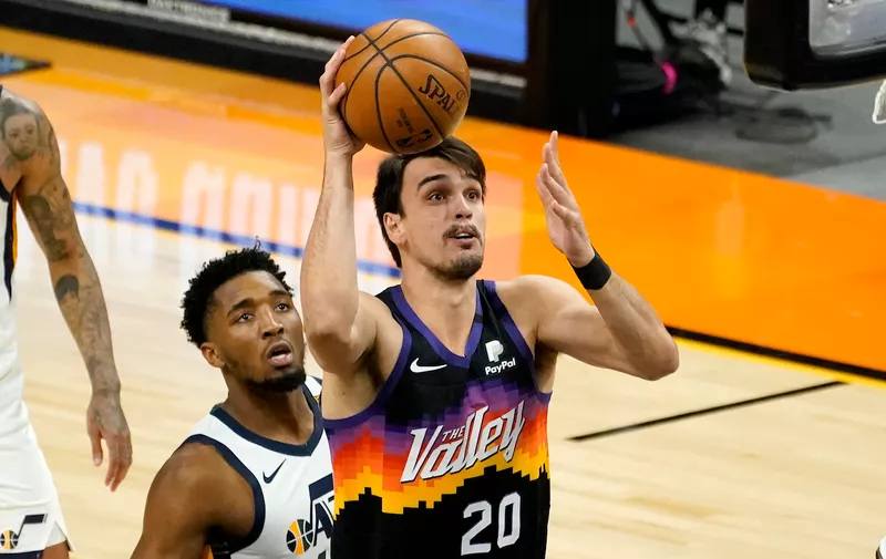Phoenix Suns forward Dario Saric (20) shoots against the Utah Jazz during the first half of an NBA basketball game, Wednesday, April 7, 2021, in Phoenix. (AP Photo/Matt York)
