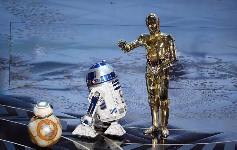 HOLLYWOOD, CA - FEBRUARY 28: (L-R) BB-8, R2-D2 and C-3PO from 'Star Wars' appear onstage during the 88th Annual Academy Awards at the Dolby Theatre on February 28, 2016 in Hollywood, California.   Kevin Winter/Getty Images/AFP