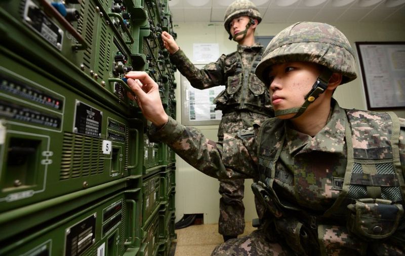 South Korean soldiers adjust equipment at a broadcasting room as they prepare propaganda broadcasts near the border area between South Korea and North Korea in Yeoncheon, northeast of Seoul, on January 8, 2016.  South Korea on January 8 resumed high-decibel propaganda broadcasts into North Korea as the United States ramped up pressure on China to bring Pyongyang to heel after its latest nuclear test.  REPUBLIC OF KOREA OUT  NO ARCHIVES  RESTRICTED TO SUBSCRIPTION USE     AFP PHOTO / YONHAP / AFP / YONHAP / YONHAP