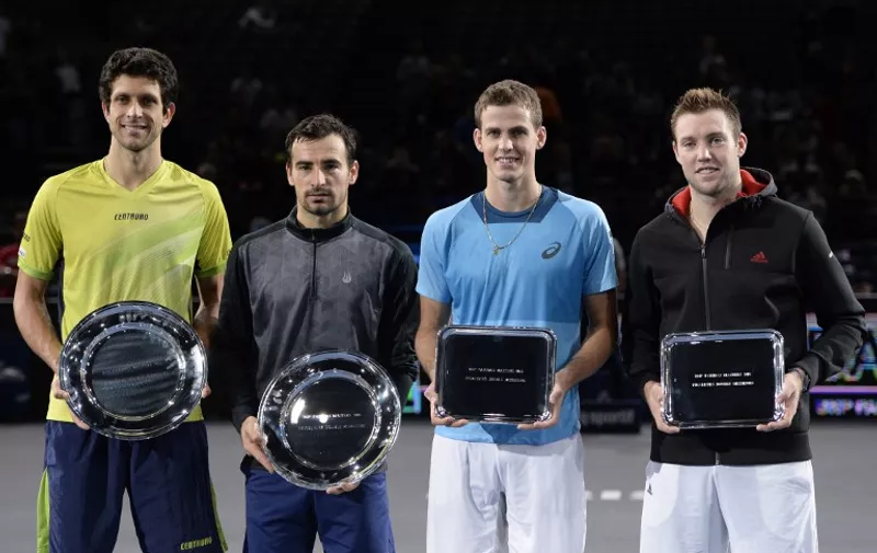 (From L) First place winners Brazil's Marcelo Melo and Croatia's Ivan Dodig and second place winners Canada's Vasek Pospisil and the USA's Jack Sock pose with their trophies after the doubles final at the ATP World Tour Masters 1000 indoor tennis tournament in Paris on November 8, 2015. 