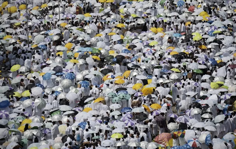 Muslim pilgrims gather to perform noon and afternoon prayers at Namira Mosque in Mount Arafat, southeast of the Saudi holy city of Mecca, on September 23, 2015. Arafat Day, on the 9th of the Islamic month of Dhul Hijja, is the climax of the hajj season. Pilgrims gather on the hill known as Mount Arafat, and its surrounding plain, where they remain until evening for prayer and Koran recitals. Prophet Mohammed is believed to have delivered his final hajj sermon there. AFP PHOTO/MOHAMMED AL-SHAIKH