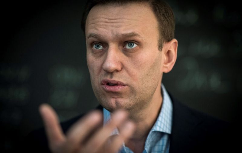 (FILES) In this file photo taken on January 16, 2018 Russian opposition leader Alexei Navalny speaks during an interview with AFP at the office of his Anti-corruption Foundation (FBK) in Moscow. - The Russian opposition leader Alexei Navalny was in intensive care in a Siberian hospital on August 20, 2020 after he fell ill in what his spokeswoman said was a suspected poisoning. (Photo by Mladen ANTONOV / AFP)