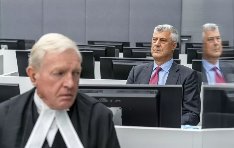 Kosovar former president Hashim Thaci sits with his lawyer David Hooper (L)  for the first time before a war crimes court in The Hague on November 9, 2020, to face charges relating to the 1990s conflict with Serbia. - The one-time guerrilla leader, 52, who resigned as president last week, wore a grey suit and red tie for the hearing at the Kosovo Specialist Chambers in the Dutch city. (Photo by Jerry Lampen / various sources / AFP) / Netherlands OUT