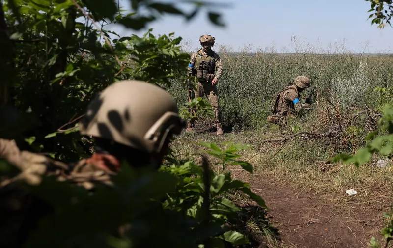 Ukrainian servicemen of 22th mechanized brigade operate at a recaptured position near Klyshchiivka village, south of Bakhmut, Donetsk region on July 13, 2023. (Photo by Anatolii Stepanov / AFP)
