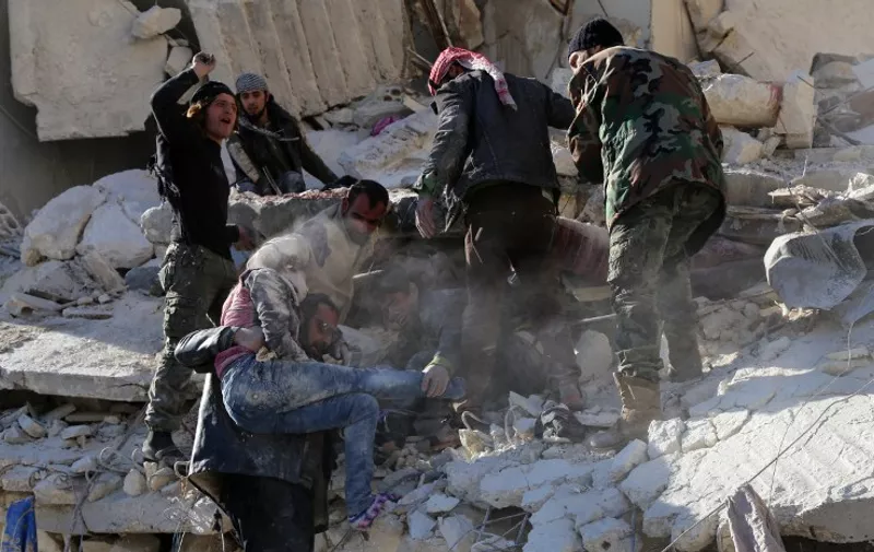Syrian civilians and rebel fighters remove a girl and search for other victims amid the rubble of a building following a reported air strike by Syrian government forces on the Sukkari neighborhood of Syria's northern city of Aleppo on December 7, 2015. Syria's nearly five-year war has left more than 250,000 dead and forced some 12 million people from their homes. / AFP / BARAA AL-HALABI