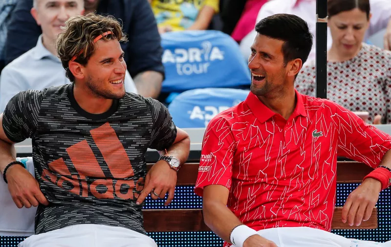 BELGRADE, SERBIA - JUNE 12: Dominic Thiem (L) of Austria and Novak Djokovic (R) of Serbia smile during an exhibition double match of the Adria Tour charity exhibition hosted by Novak Djokovic, on June 12, 2020 in Belgrade, Serbia. (Photo by Srdjan Stevanovic/Getty Images)