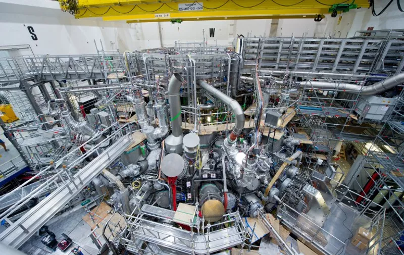 View of the Wendelstein 7-X fusion device taken on September 18, 2015 at the Max Planck Institute for Plasma Physics in Greifswald, northeastern Germany. According to the institute, the Wendelstein 7-X fusion device is the worlds largest and most advanced device of the stellarator type. The objective of fusion research is to develop a power plant favourable to the climate and environment that derives energy from the fusion of atomic nuclei just as the sun and the stars do. AFP PHOTO / DPA / STEFAN SAUER +++ GERMANY OUT +++ / AFP / DPA / STEFAN SAUER
