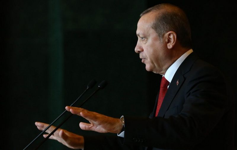 A handout picture taken and released by Turkish presidential press office on January 12, 2016 shows Turkish President Recep Tayyip Erdogan delivering a speech during the Ambassador's Conference at the Presidential Complex in Ankara.
Turkish President Recep Tayyip Erdogan said today's attack on Istanbul's tourist heart that killed 10 people and wounded 15 was carried out by a suicide bomber of Syrian origin and foreigners were among the dead. / AFP / TURKISH PRESIDENTIAL PRESS OFFICE / KAYHAN OZER / RESTRICTED TO EDITORIAL USE - MANDATORY CREDIT "AFP PHOTO /TURKSIH PRESIDENTIAL PRESS OFFICE /KAYHAN OZER" - NO MARKETING NO ADVERTISING CAMPAIGNS - DISTRIBUTED AS A SERVICE TO CLIENTS