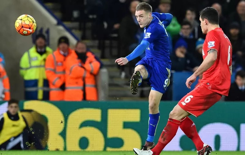 Leicester City's English striker Jamie Vardy (L) shoots to score the opening goal of the English Premier League football match between Leicester City and Liverpool at King Power Stadium in Leicester, central England on February 2, 2016. / AFP / Ben STANSALL / RESTRICTED TO EDITORIAL USE. No use with unauthorized audio, video, data, fixture lists, club/league logos or 'live' services. Online in-match use limited to 75 images, no video emulation. No use in betting, games or single club/league/player publications.  /