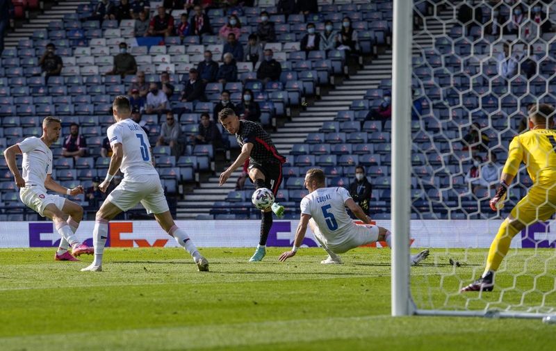 Croatia's forward Ivan Perisic shoots and scores his team's first goal during the UEFA EURO 2020 Group D football match between Croatia and Czech Republic at Hampden Park in Glasgow on June 18, 2021. (Photo by Petr David Josek / POOL / AFP)
