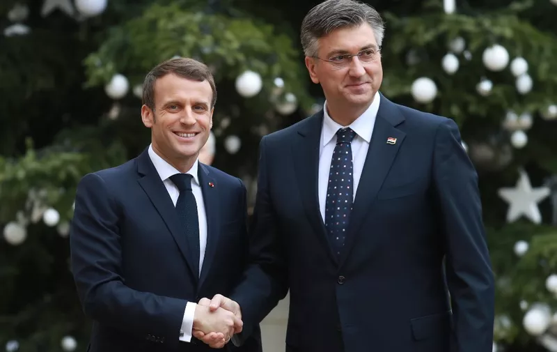 French President Emmanuel Macron (L) welcomes Croatian Prime Minister Andrej Plenkovic ahead of a meeting at the Elysee Palace in Paris on January 7, 2020. (Photo by Ludovic Marin / AFP)