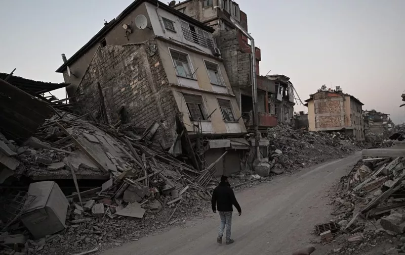 HATAY, TURKIYE - FEBRUARY 22: A view of a collapsed building at the historical Antakya district in Hatay, Turkiye on February 22, 2023. On Feb. 06, a strong 7.7 earthquake, centered in the Pazarcik district, jolted Kahramanmaras and strongly shook several provinces, including Gaziantep, Sanliurfa, Diyarbakir, Adana, Adiyaman, Malatya, Osmaniye, Hatay, Kilis, and Elazig. Later, at 1.24 p.m. (1024GMT), a 7.6 magnitude quake centered in Kahramanmaras' Elbistan district struck the region. Two earthquakes jolted Turkiye's southernmost Hatay province on Monday, just two weeks after major quakes hit the region. According to the Disaster and Emergency Management Presidency (AFAD), one of the quakes took place at around 20.04 p.m. local time (1704GMT) in the Defne district of Hatay, with a magnitude of 6.4, while the other took place three minutes later, with the epicenter in Hatay's Samandag province, with a magnitude of 5.8. Elif Ozturk Ozgoncu / Anadolu Agency (Photo by Elif Ozturk Ozgoncu / ANADOLU AGENCY / Anadolu Agency via AFP)