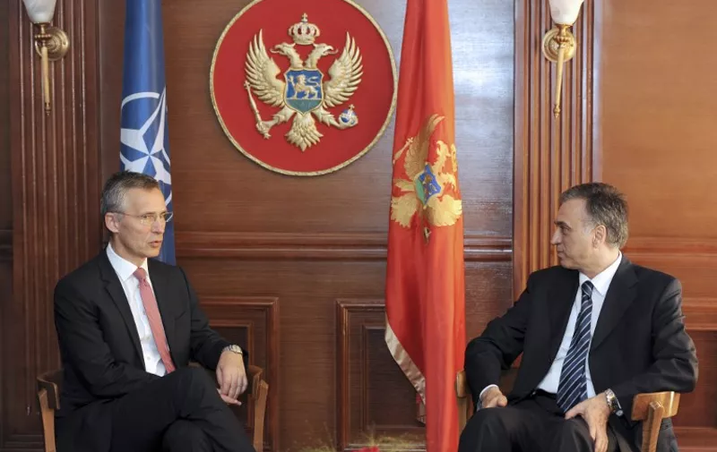 Montenegrin President Filip Vujanovic (R) talks with NATO general secretary Jans Soltenber (L) during their meeting in Podgorica on June 11, 2015. AFP PHOTO / SAVO PRELEVIC / AFP / SAVO PRELEVIC