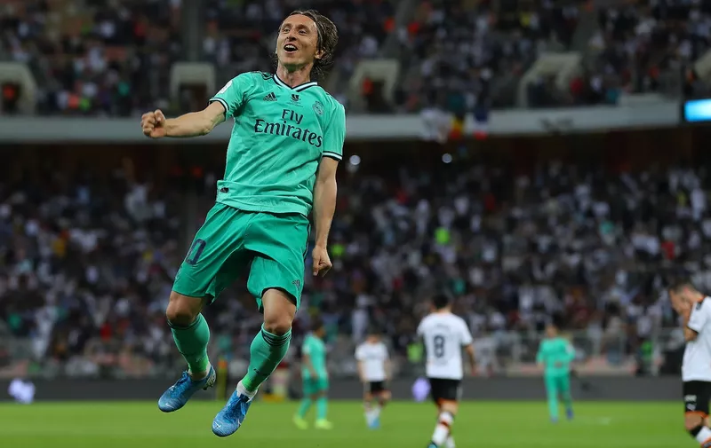JEDDAH, SAUDI ARABIA - JANUARY 08: Luka Modric of Real Madrid celebrates after scoring his team's third goal during the Supercopa de Espana Semi-Final match between Valencia CF and Real Madrid at King Abdullah Sports City on January 08, 2020 in Jeddah, Saudi Arabia. (Photo by Francois Nel/Getty Images)