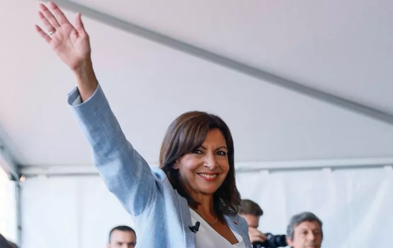 The mayor of Paris, member of the French Socialist Party (Parti Socialiste - PS) Anne Hidalgo waves in Rouen, western France, on September 12, 2021 after announcing that she plans to stand as a PS candidate in next year's presidential elections. -  (Photo by Thomas SAMSON / AFP)