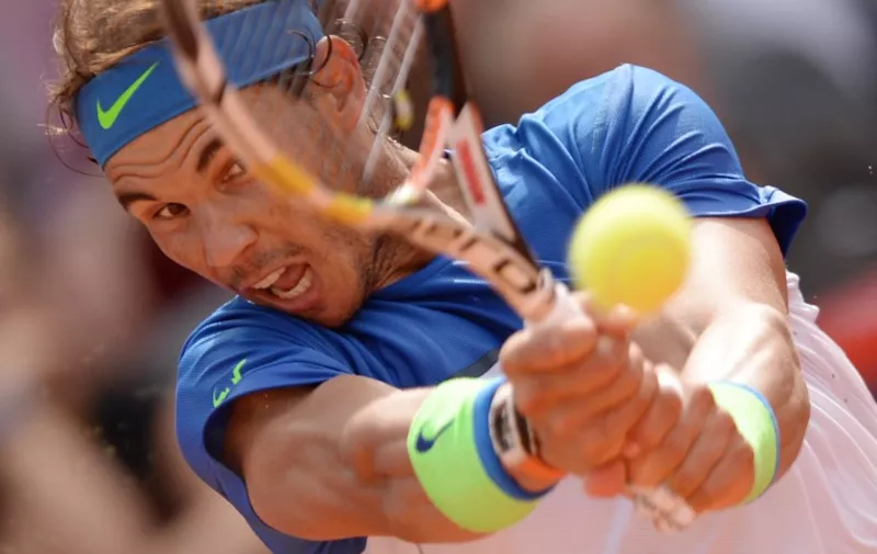 Spain's Rafael Nadal returns a ball to Italy's Fabio Fognini during their final tennis match of the ATP tennis tournament in Hamburg, northern Germany on August 2, 2015. Nadal won the match 7-5, 7-5.     AFP PHOTO / DPA / DANIEL REINHARDT+++ GERMANY OUT