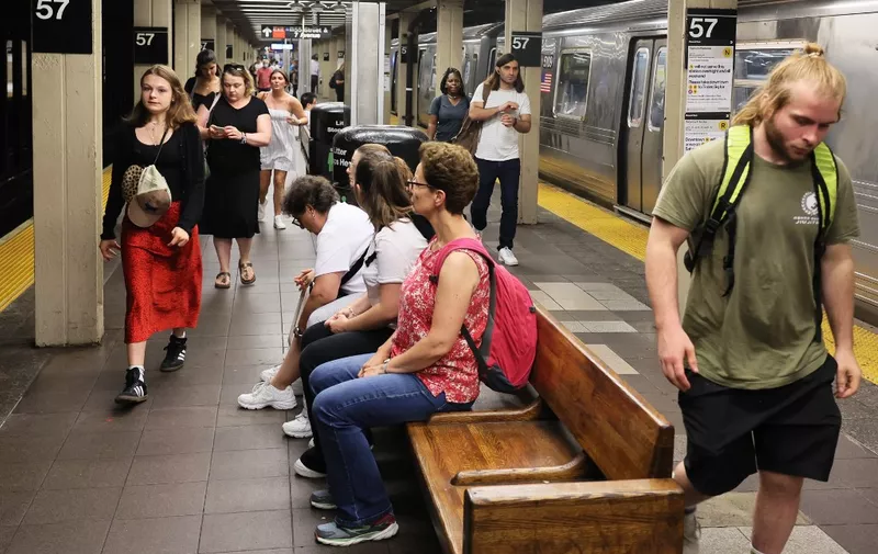 NEW YORK, NEW YORK - JULY 19: People walk along the subway platform at the 57th Street subway station on July 19, 2023 in New York City. The MTA board announced that subway and bus fares will increase from $2.75 to $2.90 on August 20, the first fare hike since 2019 and the first increase in the base subway and bus fare since 2015. NYC Transit, LIRR, and Metro-North Railroad fares will also go up 4% and tolls on MTA bridges and tunnels will rise an average of 5.5% and as much as 10% for those who don't have E-Z Pass as well on August 6th.   Michael M. Santiago/Getty Images/AFP (Photo by Michael M. Santiago / GETTY IMAGES NORTH AMERICA / Getty Images via AFP)