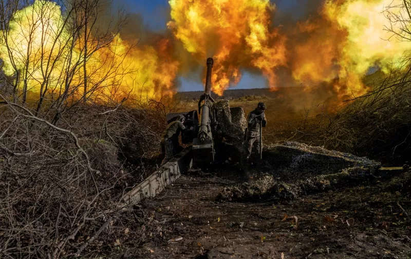 A Ukrainian soldier of a artillery unit fires towards Russian positions outside Bakhmut on November 8, 2022, amid the Russian invasion of Ukraine. (Photo by BULENT KILIC / AFP)