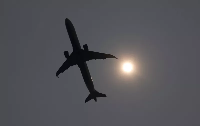 A Delta Airbus A321 airplane takes off into a smoke haze from Ronald Reagan Washington National Airport in Arlington, Virginia, June 8, 2023, as smoke from wildfires in Canada blankets the area. Smoke from Canadian wildfires have shrouded the US East Coast in a record-breaking smog, forcing cities to issue air pollution warnings and thousands of Canadians to evacuate their homes. The devastating fires have displaced more than 20,000 people and scorched about 3.8 million hectares (9,390,005 acres) of land. Prime Minister Justin Trudeau described this wildfire season as the country's worst ever. (Photo by SAUL LOEB / AFP)