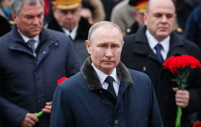 Russian President Vladimir Putin attends a wreath-laying ceremony at the Tomb of the Unknown Soldier by the Kremlin wall to mark the Defender of the Fatherland Day in Moscow on February 23, 2020. - The Defender of the Fatherland Day, celebrated in Russia on February 23, honours the nation's army and is a nationwide holiday. (Photo by YURI KOCHETKOV / POOL / AFP)
