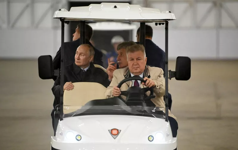 Russian President Vladimir Putin, accompanied by Leonid Mikhelson, the founder and chief of Russia's largest private gas group Novatek, visits the Center for the construction of large-tonnage offshore structures (CSCMS) of Novatek-Murmansk company in the village of Belokamenka in the Murmansk region on July 20, 2023. (Photo by Alexander KAZAKOV / SPUTNIK / AFP)