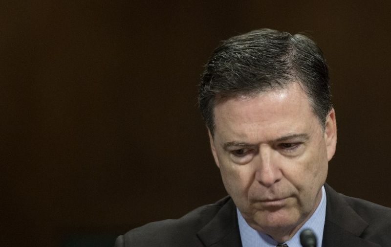 (FILES) This file photo taken on May 3, 2017 shows FBI Director James Comey as he testifies before the Senate Judiciary Committee on Capitol Hill in Washington, DC.
US President Donald Trump on May 9, 2017 made the shock decision to fire his FBI director James Comey, the man who leads the agency charged with investigating his campaign's ties with Russia."The president has accepted the recommendation of the Attorney General and the deputy Attorney General regarding the dismissal of the director of the Federal Bureau of Investigation," White House spokesman Sean Spicer told reporters.
 / AFP PHOTO / JIM WATSON