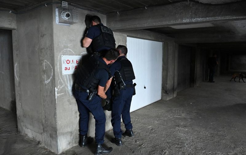 (FILES) French police officers patrol in the Pissevin disctrict of Nimes, sourthern France, on October 11, 2023. Under the spotlight since the death of a 10-year-old child, collateral victim of a shooting in August 2023, the Pissevin district of the French southern city of Nimes and its illegal drug trade are at the heart of a trial to open on December 11, 2023, before the criminal court of Marseille, southern France. (Photo by Sylvain THOMAS / AFP)