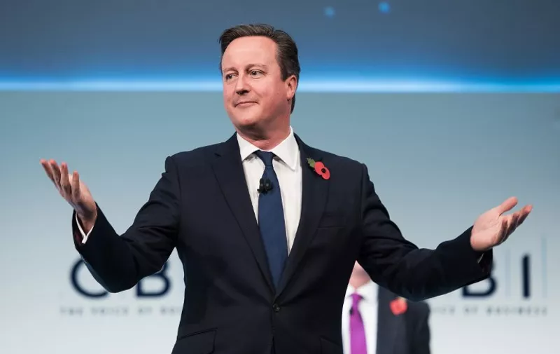 British Prime Minister David Cameron reacts as he is interrupted by hecklers during his address to delegates at the annual Confederation of British Industry (CBI) conference in central London, on November 9, 2015. Britain can survive outside the European Union, Cameron said as he denied he was planning to campaign for Britain to stay in the EU regardless of the outcome of reform talks.    AFP PHOTO / LEON NEAL
