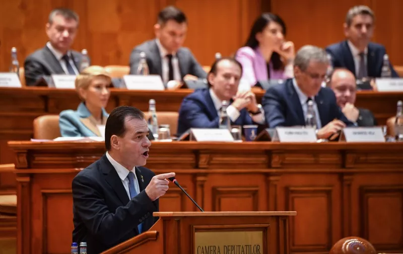 Romanian Prime Minister Ludovic Orban delivers his speech during a no-confidence vote initiated by the Social Democrat Party (PSD) at the Romanian Parliament in Bucharest on February 5, 2020. - Romania's liberal government collapsed in a parliamentary no-confidence vote on on February 5, 2020 after only three months in office, bringing the EU member closer to early elections.
A total of 261 of 465 MPs voted in favour of a motion against the minority government led by Ludovic Orban, which took over in November. (Photo by Daniel MIHAILESCU / AFP)