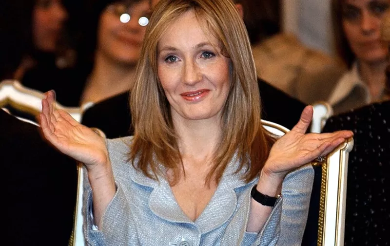 Britain's J.K. Rowling, the author of the internationally best-selling series of books about the young wizard Harry Potter applauds a performance by Romanian orphans during a ceremony in Bucharest, Romania, 26 January 2006. Rowling said 26 January at the start of a two-day visit to Romania that she hoped reforms the country had made in child welfare would benefit other countries in the region. Rowling, 40, recently became a trustee of a new Bucharest-based foundation called The Children's High Level Group, which raises money for children in need and promotes childcare reforms in Romania as a model to other European countries.