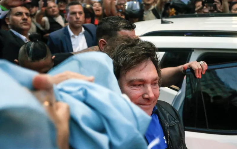 Argentine congressman and presidential candidate for the La Libertad Avanza Alliance, Javier Milei (C), greets supporters during the closure of his electoral campaign in Cordoba, Argentina, on November 16, 2023. (Photo by DIEGO LIMA / AFP)