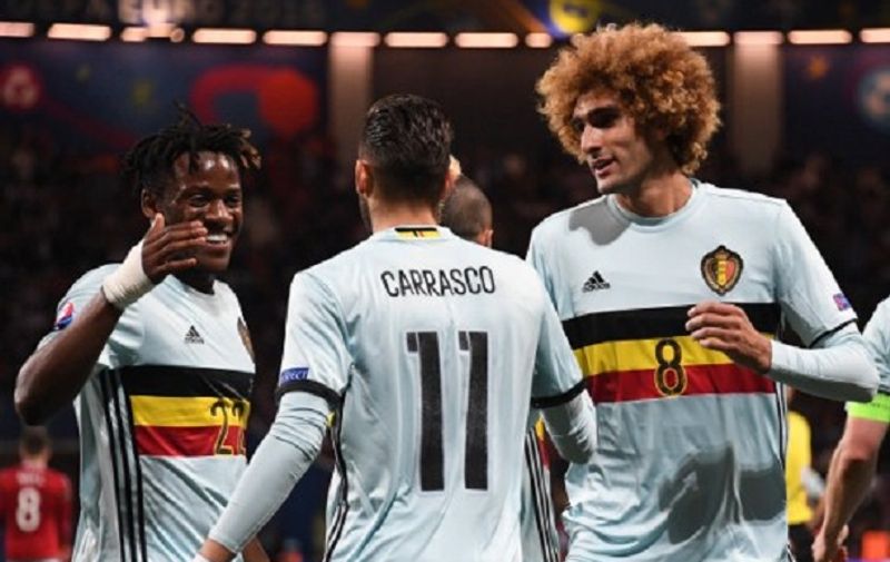 Belgium's forward Yannick Ferreira-Carrasco (C) celebrates with Belgium's forward Michy Batshuayi (L) and Belgium's midfielder Marouane Fellaini (R) after scoring his team's fourth goal  during the Euro 2016 round of 16 football match between Hungary and Belgium at the Stadium Municipal in Toulouse on June 26, 2016.   / AFP PHOTO / PASCAL GUYOT