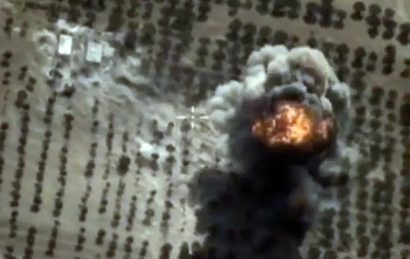 A video grab made on October 15, 2015, shows an image taken from a footage made available on the Russian Defence Ministry's official website, purporting to show an explosion after airstrikes carried out by Russian air force on what Russia says was an Islamic State facility in the Syrian province of Idlib. AFP PHOTO / RUSSIAN DEFENCE MINISTRY 
*RESTRICTED TO EDITORIAL USE - MANDATORY CREDIT " AFP PHOTO / RUSSIAN DEFENCE MINISTRY" - NO MARKETING NO ADVERTISING CAMPAIGNS - DISTRIBUTED AS A SERVICE TO CLIENTS*