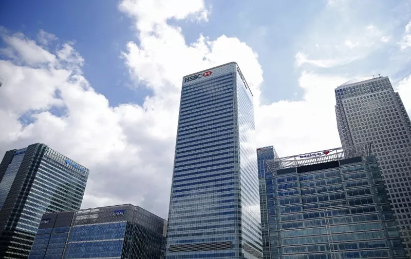 The offices of Barclays, KPMG, HSBC and Bank of America, are pictured in the Canary Wharf financial district of east London on June 26, 2016. 
British business minister Sajid Javid on Sunday urged companies not to panic following Britain's vote to leave the European Union (EU) despite dire warnings of the economic consequences of the Brexit vote. "Our economic fundamentals remain strong. They're strong enough to weather any short-term market volatility," he said, after Thursday's vote plunged global financial markets and the value of the pound. / AFP PHOTO / ODD ANDERSEN