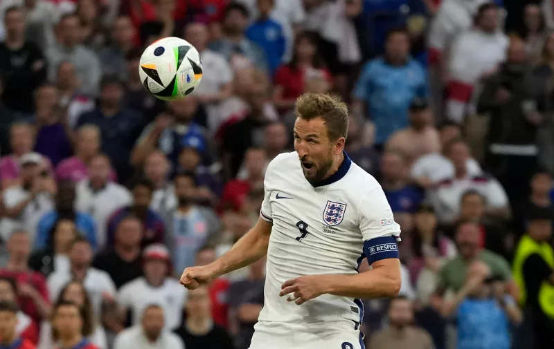 England's Harry Kane scores his side's second goal during a round of sixteen match between England and Slovakia at the Euro 2024 soccer tournament in Gelsenkirchen, Germany, Sunday, June 30, 2024. (AP Photo/Antonio Calanni)