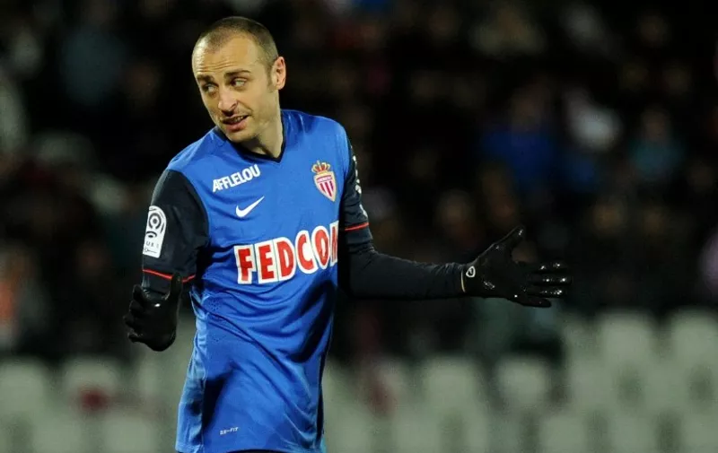 Monaco's Bulgarian forward Dimitar Berbatov celebrates after scoring a goal during the French L1 football match between Evian TG and Monaco at the Parc des Sports stadium in Annecy, southeastern France, on March 7, 2015. AFP PHOTO / JEAN-PIERRE CLATOT