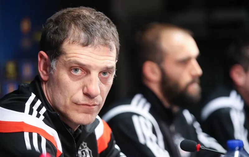 Besiktas' head coach Slaven Bilic (L) and Serdar Kurtulus defender give a press conference in Brugge, on March 11, 2015 in Brugge, on the eve of the Europa league football match Brugge vs Besiktas Istanbul. AFP PHOTO/BELGA PHOTO BRUNO FAHY