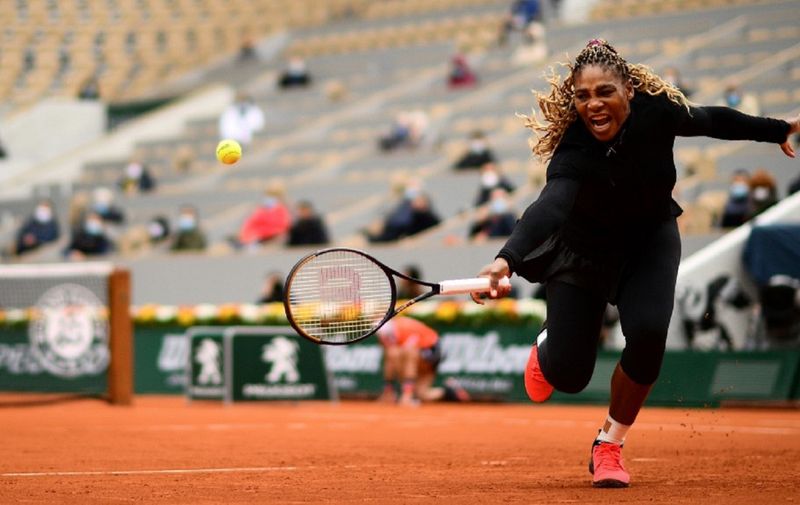 Serena Williams of the US returns the ball to Kristie Ahn of the US during their women's singles first round tennis match at the Philippe Chatrier court on Day 2 of The Roland Garros 2020 French Open tennis tournament in Paris on September 28, 2020. (Photo by Martin BUREAU / AFP)