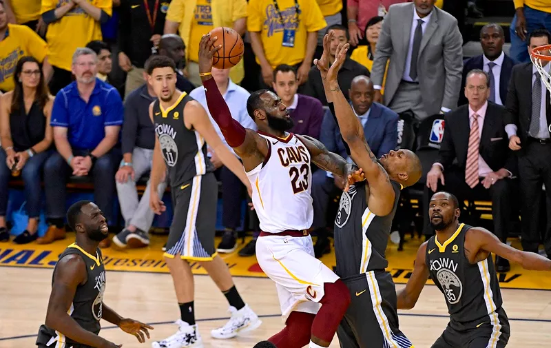 Cleveland Cavaliers&#8217; LeBron James (23) goes up for a layup against Golden State Warriors&#8217; David West (3) during the second quarter of Game 2 of the NBA Finals on Sunday, June 3, 2018 at Oracle Arena, in Oakland, Calif. (Jose Carlos Fajardo/Bay Area News Group/TNS)
