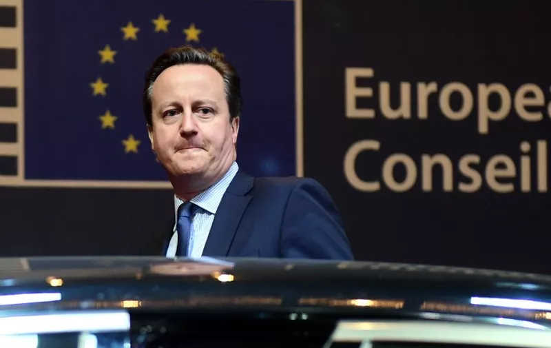 British Prime Minister David Cameron leaves at the end of the first day of an European Council leaders' meeting in Brussels, February 19, 2016. 
EU leaders head into a make-or-break summit sharply divided over difficult compromises needed to avoid Britain becoming the first country to crash out of the bloc. / AFP / Emmanuel DUNAND