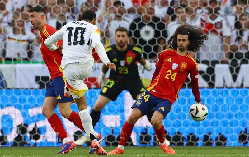 Soccer Football - Euro 2024 - Quarter Final - Spain v Germany - Stuttgart Arena, Stuttgart, Germany - July 5, 2024 Germany's Jamal Musiala shoots at goal and hits the arm of Spain's Marc Cucurella REUTERS/Lee Smith