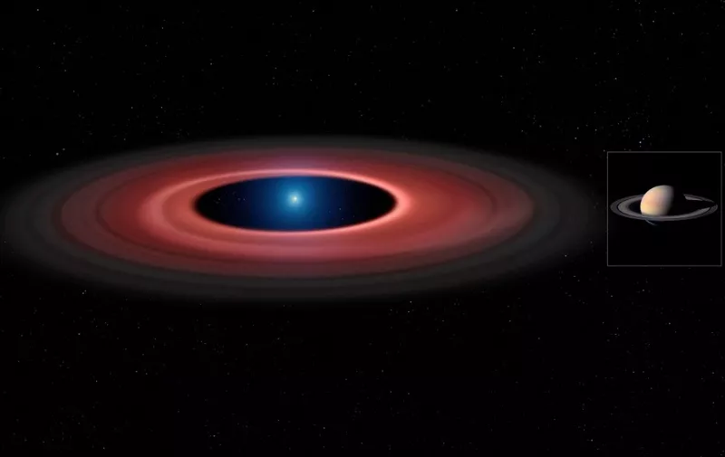 An artist's impression released by the European Southern Observatory shows the debris disc around the white dwarf SDSS J1228+1040 (left) at the same scale as Saturn and its rings (right). While the white dwarf in SDSS J1228+1040 has about seven times smaller diameter than Saturn, it has a mass 2500 times greater. AFP PHOTO / MARK GARLICK / UNIVERSITY OF WARWICK /ESO/NASA/CASSINI
= RESTRICTED TO EDITORIAL USE - MANDATORY CREDIT "AFP PHOTO / MARK GARLICK / UNIVERSITY OF WARWICK /ESO/NASA/CASSINI" - NO MARKETING NO ADVERTISING CAMPAIGNS - DISTRIBUTED AS A SERVICE TO CLIENTS = (Photo by MARK GARLICK / ESO / AFP)