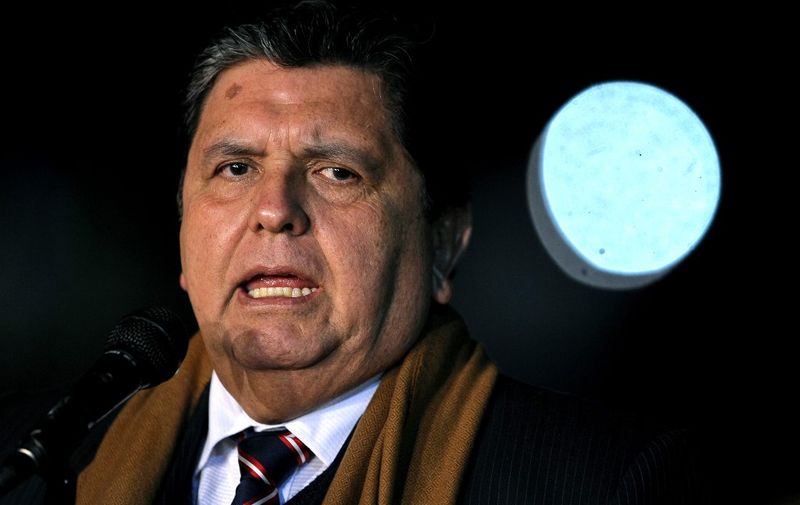 (FILES) In this file photo taken on September 30, 2010 Peruvian President Alan Garcia gestures as he speaks upon his arrival at the military airport in Buenos Aires. - Peru's former president Alan Garcia shot himself in the head at his home on April 17, 2019 as police were about to arrest him in a sprawling corruption case, his lawyer and hospital officials said. The 69-year-old Garcia was undergoing surgery for "a bullet wound to his head" at the Casimiro Ulloa Emergency Hospital in Lima, the hospital said. (Photo by Alejandro PAGNI / AFP)