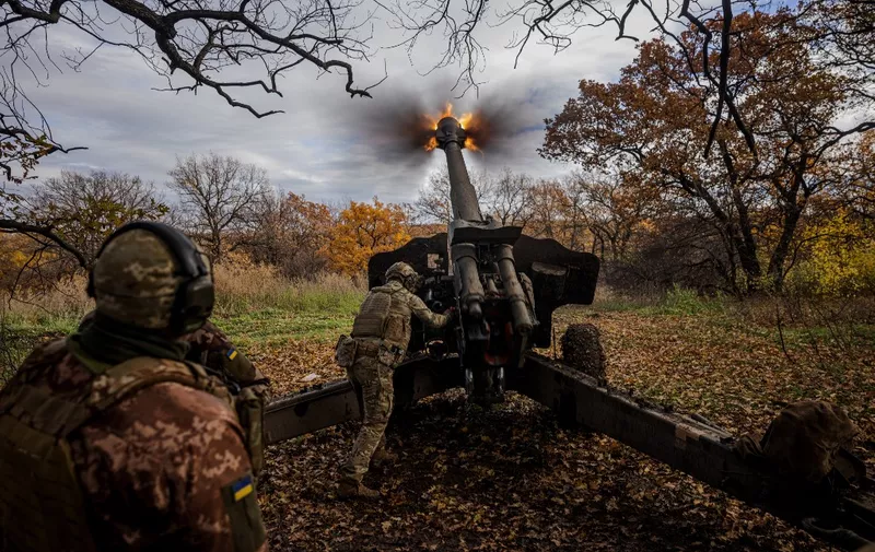 Ukrainian artillerymen fire a 152 mm towed gun-howitzer (D-20) at a position on the front line near the town of Bakhmut, in eastern Ukraine's Donetsk region, on October 31, 2022, amid Russian invasion of Ukraine. (Photo by Dimitar DILKOFF / AFP)