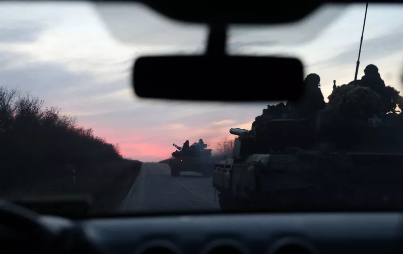 Ukrainian tanks ride on a road outside Avdiivka, Donetsk region, on November 13, 2023, amid the Russian invasion in Ukraine. (Photo by Anatolii Stepanov / AFP)